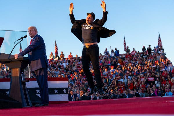 Elon acting like a human jumping bean, with a hilariously dumb look on his face